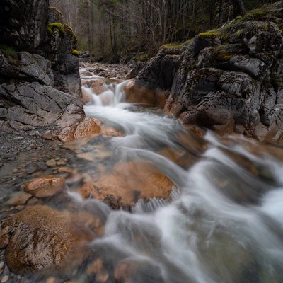 Mountain Stream Flowing Over Rocks