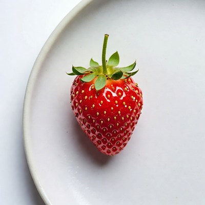 Fresh strawberry on white plate
