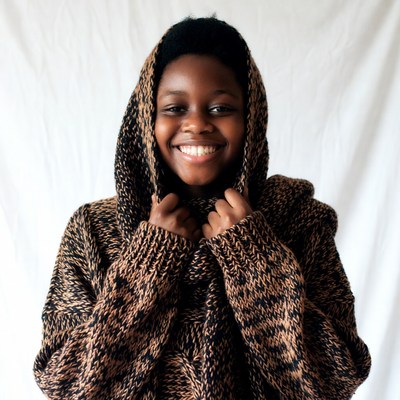 African-American girl smiling in hooded sweater
