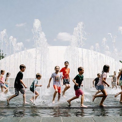 Children playing in fountain water