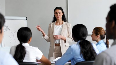 Woman presenting to diverse group