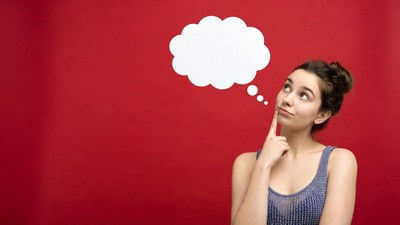 Woman thinking with empty speech bubble
