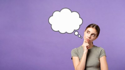 Woman thinking with empty speech bubble