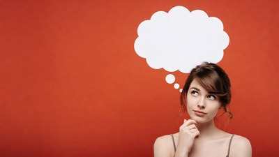 Woman thinking with empty speech bubble