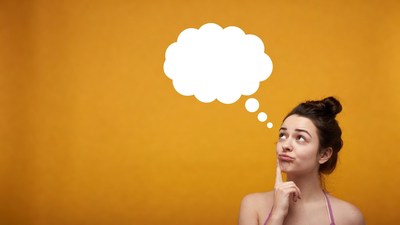 Woman thinking with blank speech bubble