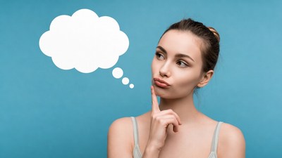 Woman thinking with blank speech bubble