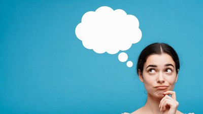 Woman thinking with blank speech bubble