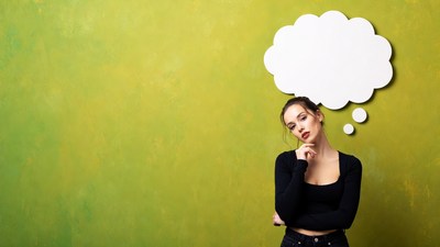 Woman thinking with empty speech bubble