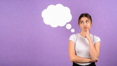 Woman thinking with empty speech bubble
