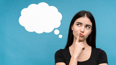 Woman thinking with thought bubble