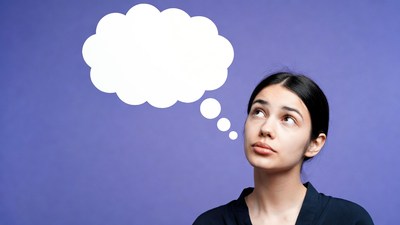 Woman thinking with empty speech bubble