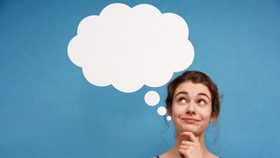 Woman thinking with blank speech bubble
