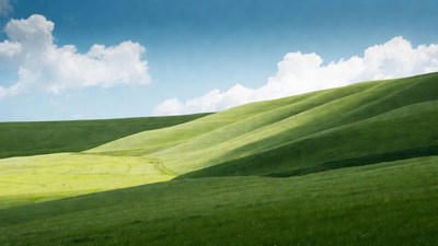 Rolling Green Hills Under Blue Sky