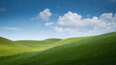 Rolling Green Hills Under Blue Sky
