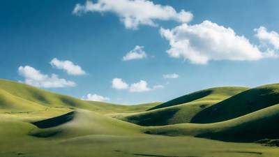 Rolling Green Hills Under Blue Sky