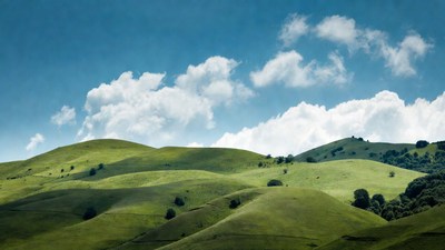 Rolling Green Hills Under Blue Sky