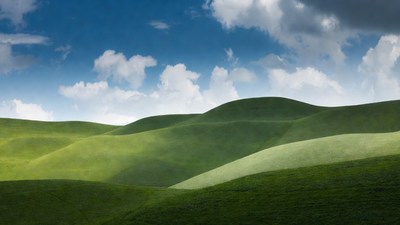 Rolling Green Hills Under Blue Sky