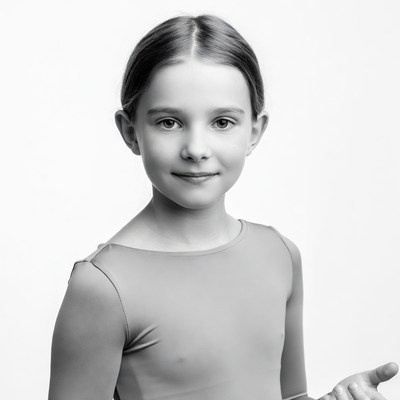 Young girl pointing in leotard