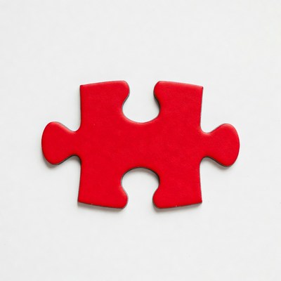 Red puzzle piece on white