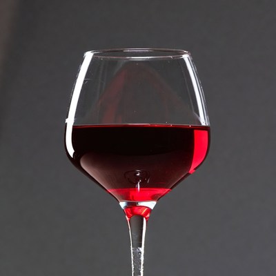 Red Wine Glass on Dark Background