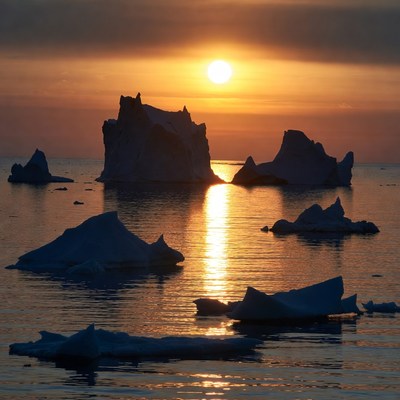 Icebergs in sunset over Arctic sea