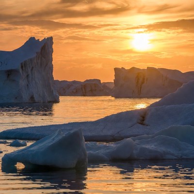 Icebergs in sunset Arctic waters