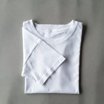 Folded White T-Shirt on Gray Background