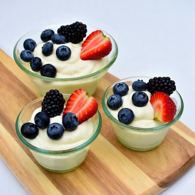 Three Berry Yogurt Parfaits on Wood