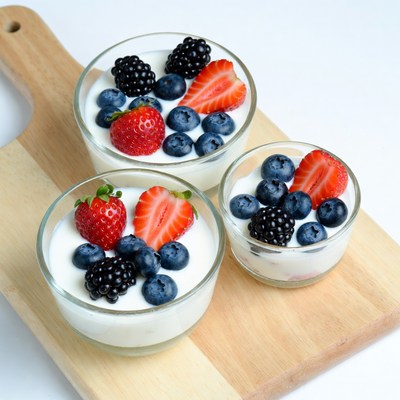Yogurt with Berries on Wooden Board