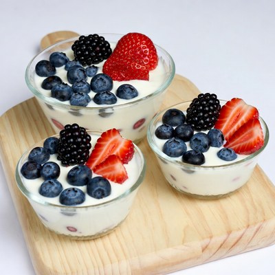Yogurt Parfaits with Berries on Wooden Board
