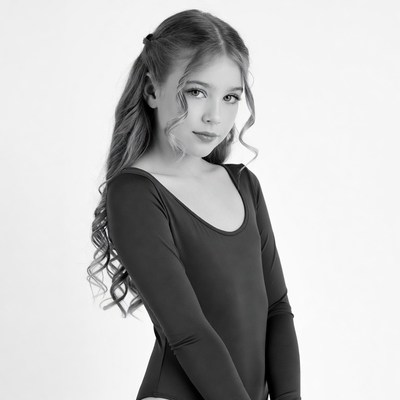 Young girl in black leotard