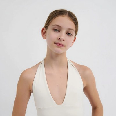 Teen girl in white halter dress