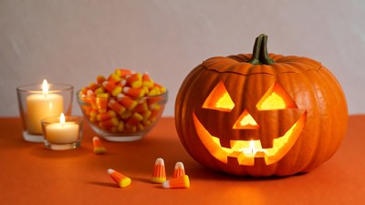 Lit Jack-O-Lantern with Candy and Candles