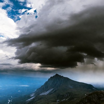Dramatic Clouds Over Mountain Peak