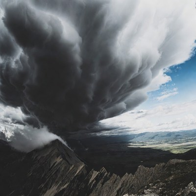 Dramatic Cumulus Clouds Over Mountains