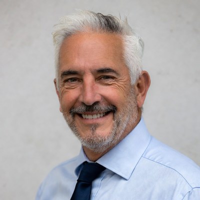 Smiling senior man in blue shirt