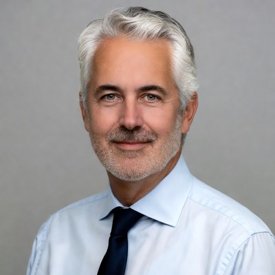 Elderly man in suit smiling