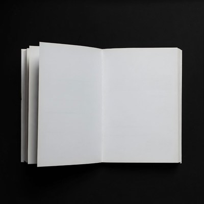 Open Blank Book on Black Background