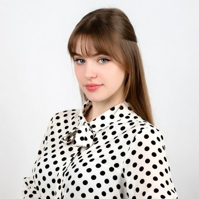 Young woman in polka dot blouse