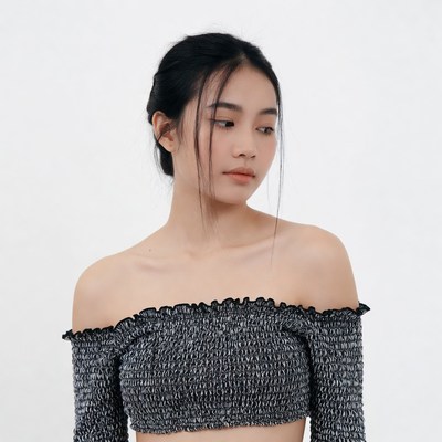 Asian woman in off-shoulder top