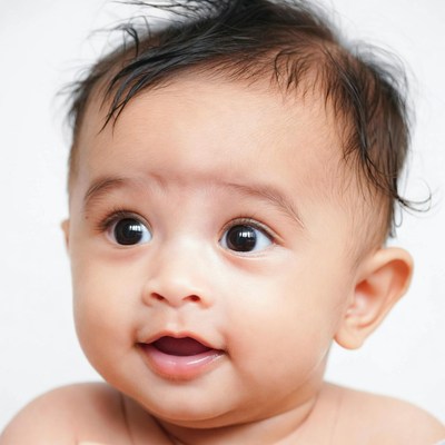 Asian baby smiling on white background