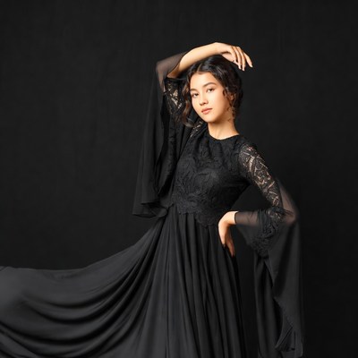 Asian woman in flowing black lace dress