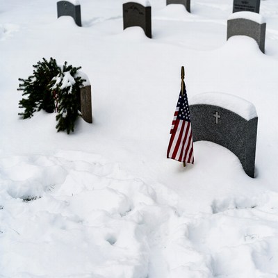 Snowy Grave with American Flag and Wreath
