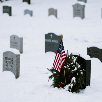 American Flag on Snowy Grave