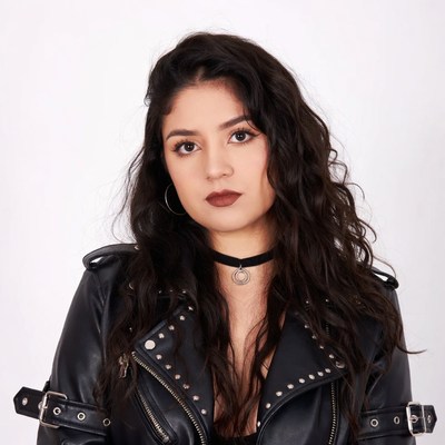 Woman in studded leather jacket