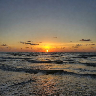 Sunset over ocean waves