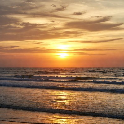 Sunset over ocean waves