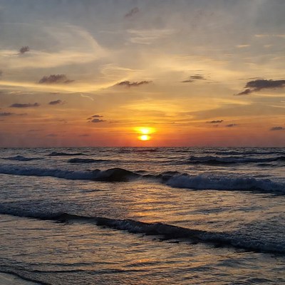 Sunset over ocean waves