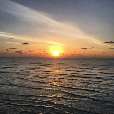 Sunset over ocean waves