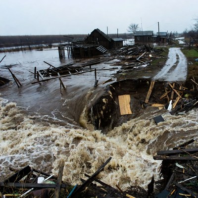 Flood Destroyed Houses and Road Sinkhole